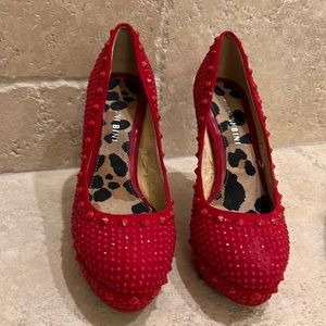 Gianni Bini red spiked high heals.
